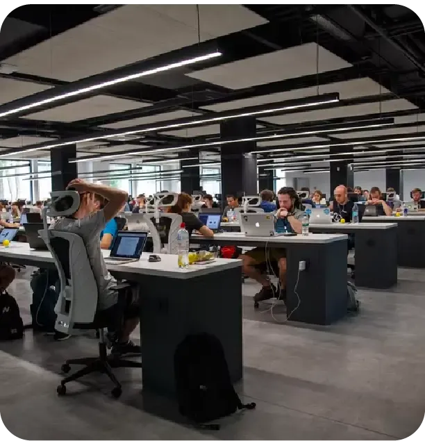 call_center-1 Open-plan office with people working at laptops